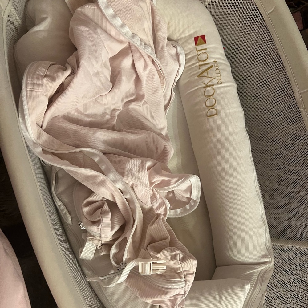 Doc-a-tot deluxe has two covers only used for about a month .$100 OBO